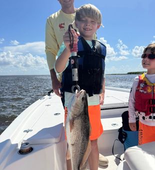 Exciting catch — big Redfish success on the water!