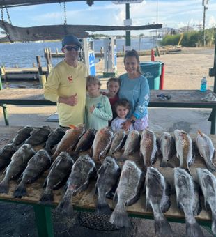Family fishing victory — Redfish & Black Drum action!