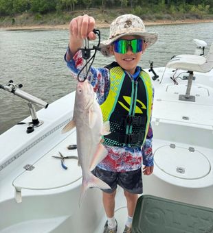 Levi lands another solid Lake Texoma blue catfish!
