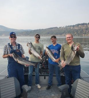 Father and sons with their fish