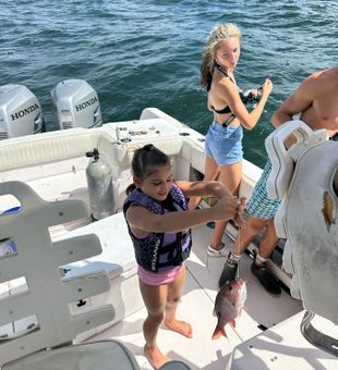 Proud young angler’s colorful snapper catch!