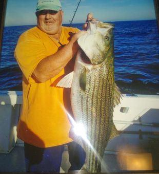 Sandy Hook striped bass fishing catch on deck