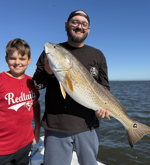 Nice redfish on light tackle! Clearing skies made for an exciting adventure.