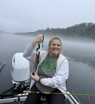 A feisty rainbow trout caught under partly cloudy skies - a perfect day for the best fishing!