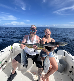 Reeling in a Little Tunny in stormy West Palm Beach waters!