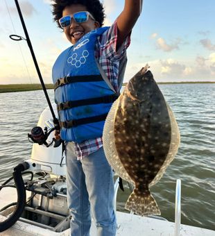 Flounder Kids reeling in