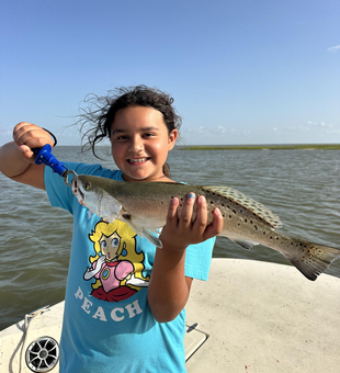Huge Spotted Weakfish hooked during a storm-threatened day!