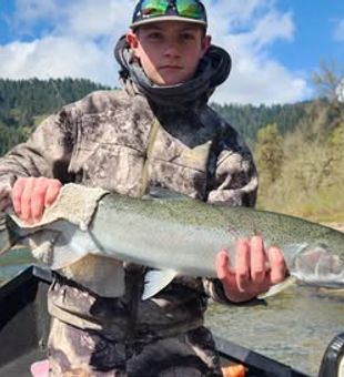 Trout on the line and not a worry in sight.