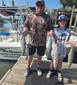Father and son with Spanish Mackerel on Murrells Inlet fishing charter
