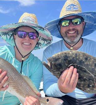 Smiles over a redfish and a flounder catch - Ocean Isle Beach, NC.