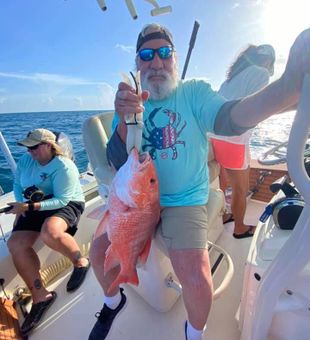Bearded angler with Red Snapper