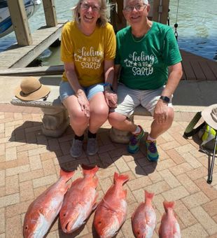 Happy couple with Red Snapper