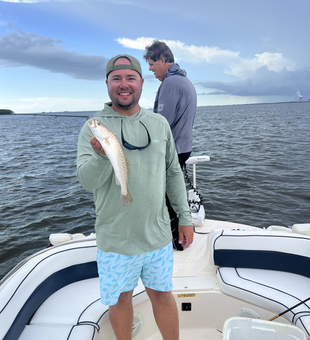 Reeling in a Spotted Weakfish on a partly cloudy day in Crystal River!