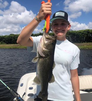 Smiling with a solid Largemouth Bass!