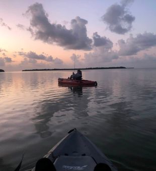 Peaceful evening kayak fishing in Delray Beach waters.
