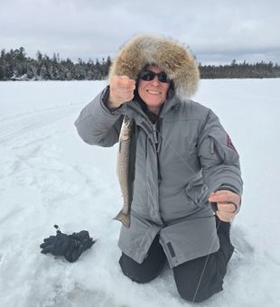 Ice fishing with a bright brook trout!