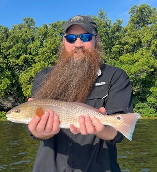 Bearded angler with a beautiful Redfish