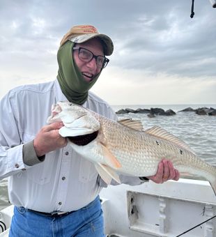 That’s the face of a fisherman who just landed a Texas-sized redfish!