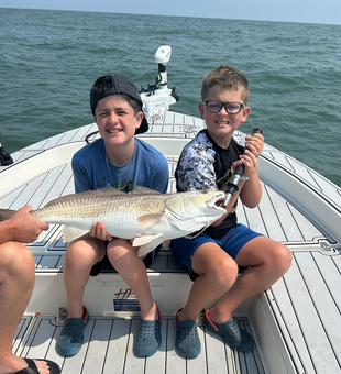 Young anglers with a trophy Redfish!