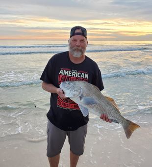 Sunset catch with a hefty red drum.