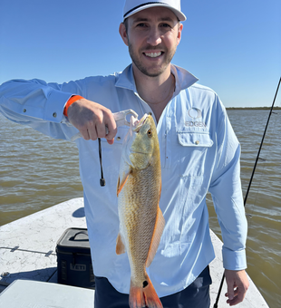 Nice redfish on the boat today! Clear skies made for perfect fishing conditions.
