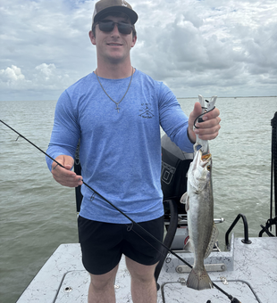Jigging success: 18-inch Spotted Weakfish reeled in!