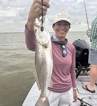 Reeling in the best Spotted Weakfish under partly cloudy Matagorda skies!