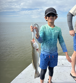 Reeling in the spotted weakfish in Matagorda, TX!