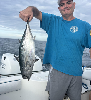 Reeled in a feisty Little Tunny on a partly cloudy day with storms possible!