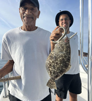 Landed a big Southern Flounder while braving the partly cloudy weather with storm potential!