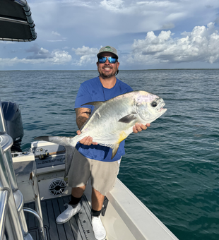 Nice permit on jigging and trolling techniques despite the cloudy conditions!