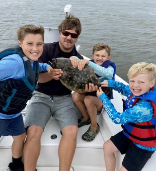 Happy Kiddos with their flounder catch! - Manns Harbor, NC.