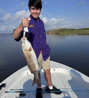 Proud with a hefty Redfish!
