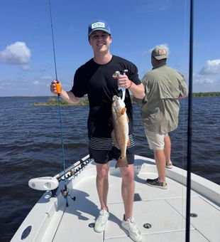 Smiling with a solid Redfish!