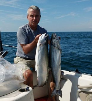 Reeling in a trophy salmon on Lake Ontario! 