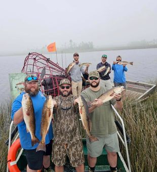 Foggy morning, full stringer—Redfish all around!