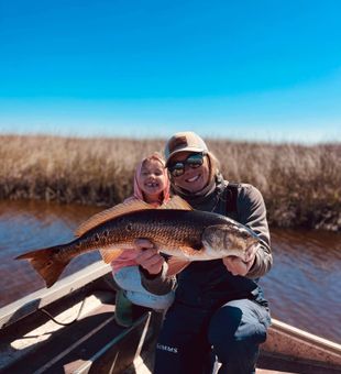 One proud catch, two happy smiles!