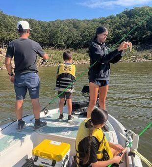 Family working as a team for fish! - Mannford, OK.