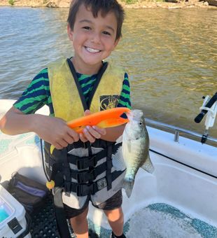 A boy and his Crappie catch - Mannford, OK.