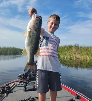 Young angler with a Headwaters Lake Bass!