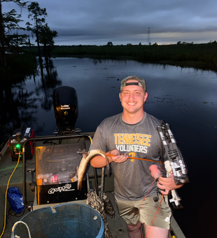 Bow fishing adventure on Orange's peaceful waters at dusk.
