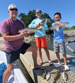 Gulf Shores speckled trout and redfish making memories!