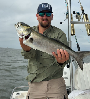 Reeling in a huge bluefish off Wanchese - the best fishing spot!