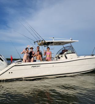 Family catching fun on a private fishing charter Anna Maria Island.