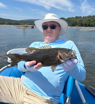 Tim with a hard fighting 16.5 incher on top water.  
