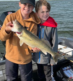Smiling kids with a beautiful walleye catch!
