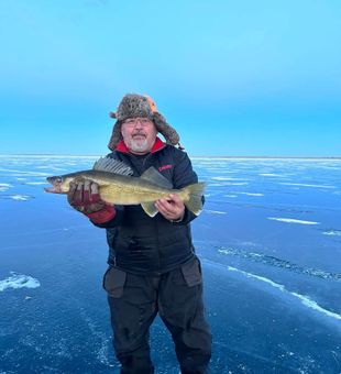 Walleye iced on frozen lake.