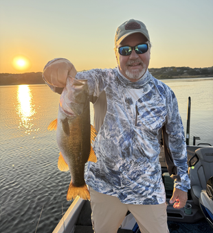 Nice Florida Bass caught on fly fishing light tackle during clear conditions at sunset.