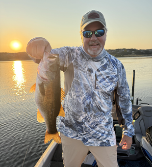 Nice largemouth bass caught on fly fishing with light tackle during perfect clear conditions!