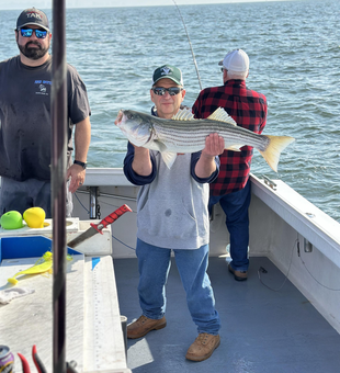 Hooked a big striped bass while deep-sea fishing in Neptune City, NJ!